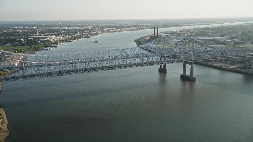 Aerial of a bridge over a river in the urban city