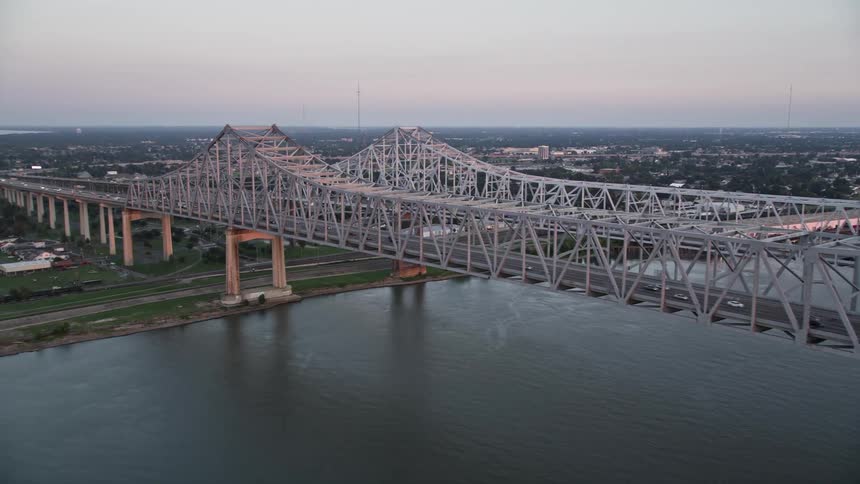 Skyline of a bridge over the river in the city during sunset