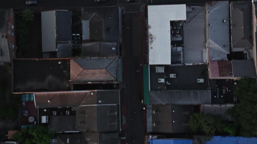View from above of the terraced roofs of buildings and streets of a metropolis