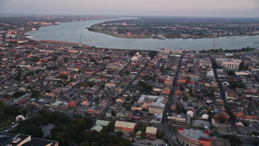 A city sprawls along the banks of a river