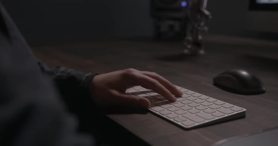Person touching a thin wireless keyboard