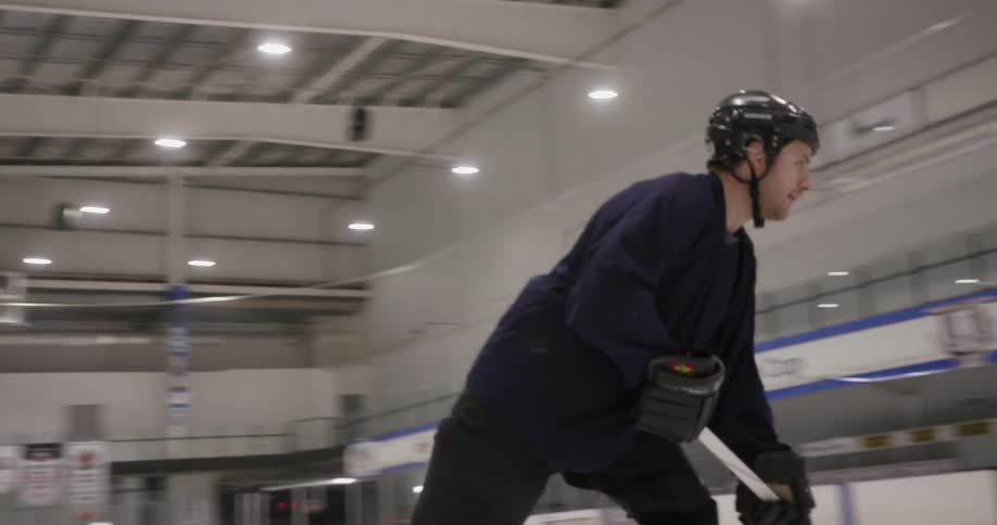A man is playing hockey