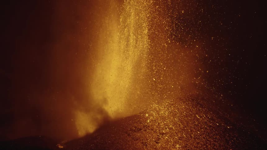 A volcano throws hot lava during an eruption