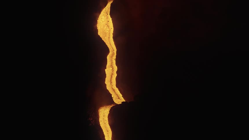 Lava pours down a mountain