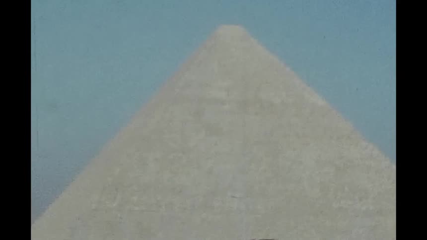 Pyramid in the desert on a cloudless blue sky day