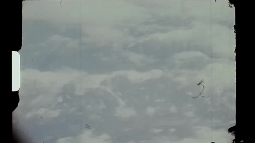 A view of the sky with many clouds from an airplane window