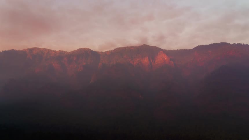 Clouds move over a mountain range