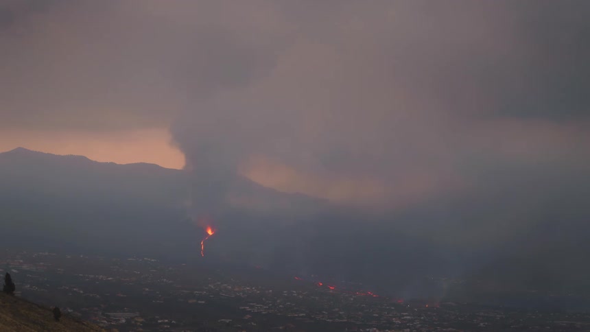 Lava from an eruption runs down a mountainside