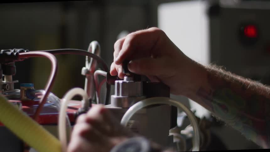 An employee uses a machine