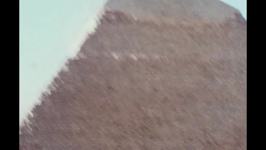 A closeup view of one of the pyramids in egypt caught on vintage film