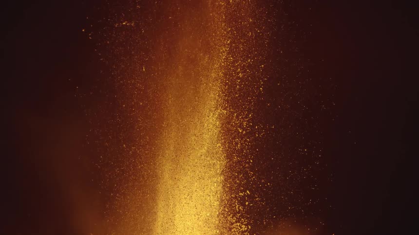 Close view slowmotion fountain of lava flames and sparks at night