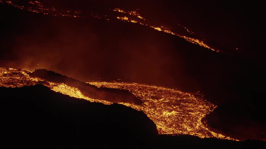 A region with lava magma on the surface of a rock and it is night