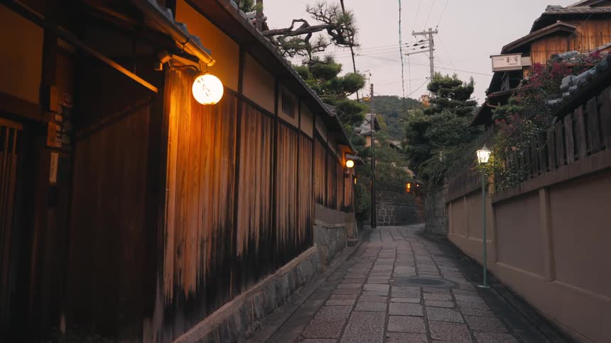 A traditional street in japan with wooden buildings and lanterns