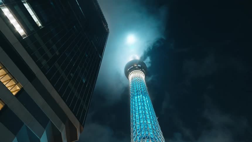 A bright tower stretches into the sky
