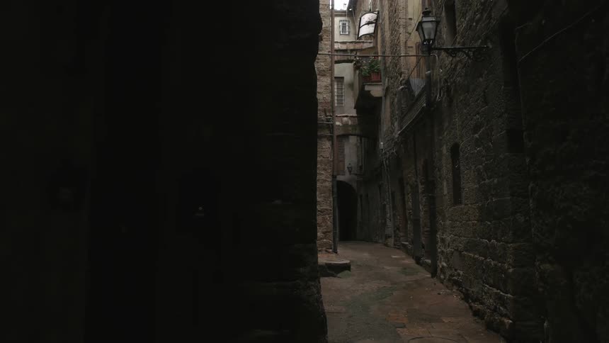 The alley is dark and empty