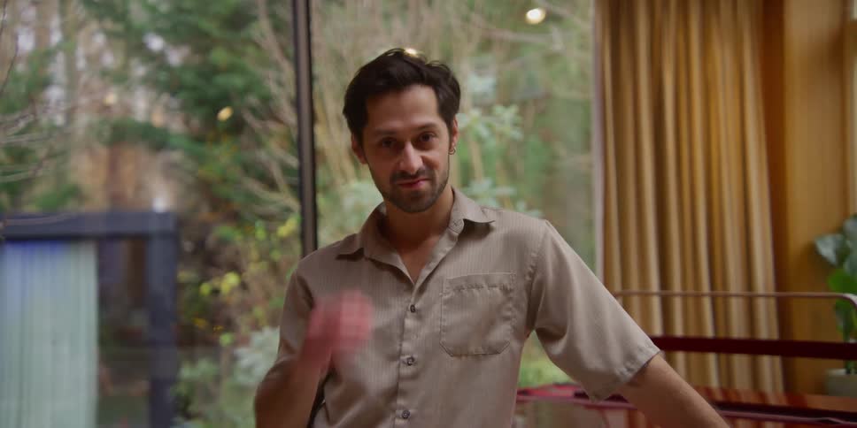 A man is standing in his home