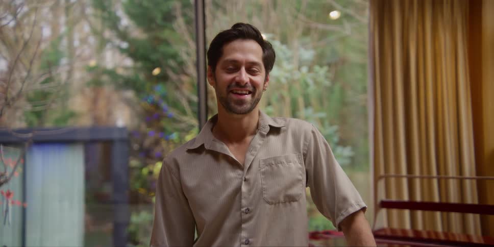 A man is smiling at home