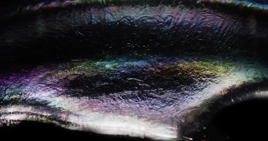 A multicolored substance moves in a wave like pattern