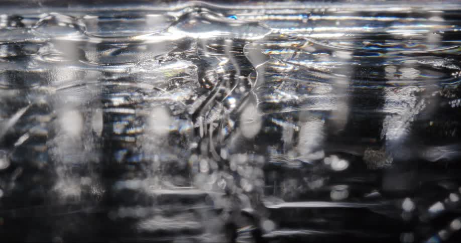 Dense and shiny liquid in abstract movement in slow motion