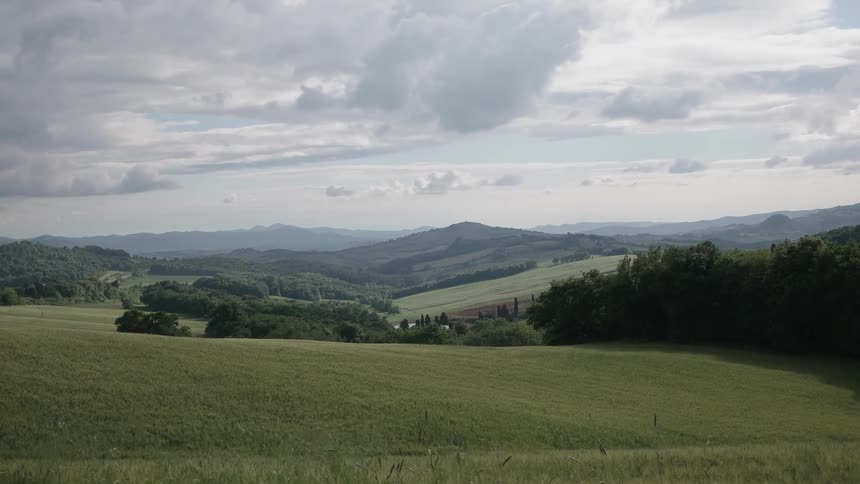 Gray clouds are hanging over a valley