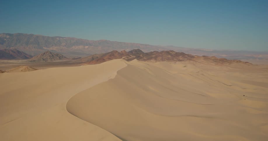 Aerial landscape of dunes through the desert