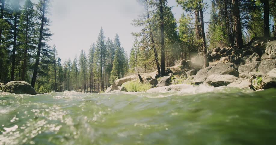 The rapids flow past the rocks