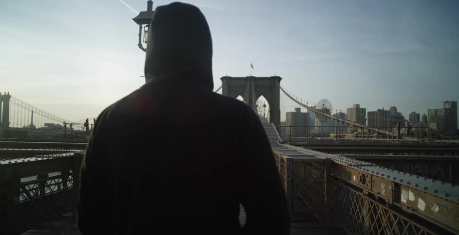 Man walking on a city bridge