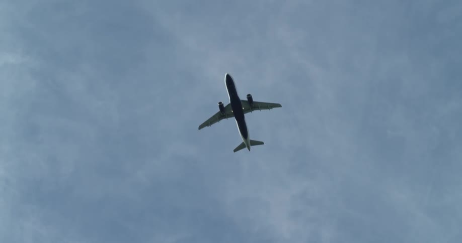 A view of the bottom of a plane as it flies overhead