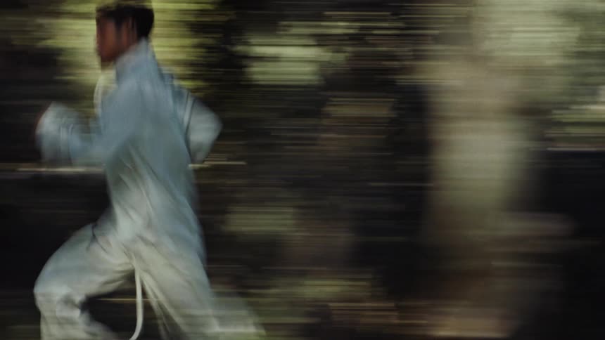 Young running through the woods