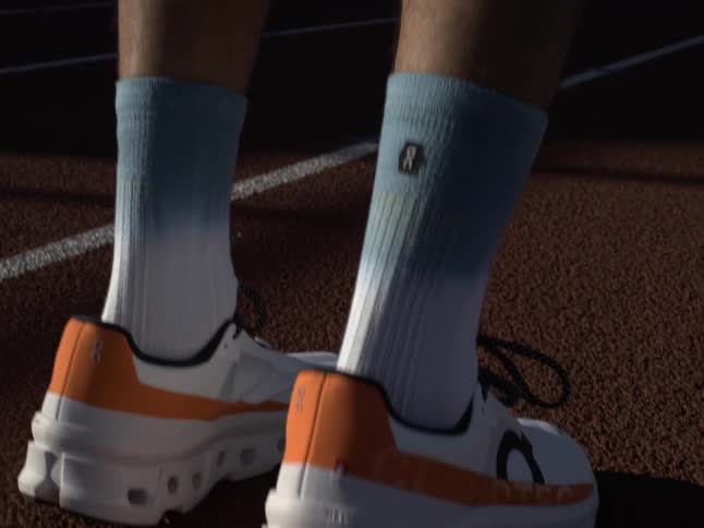 A person wearing running shoes while exercising