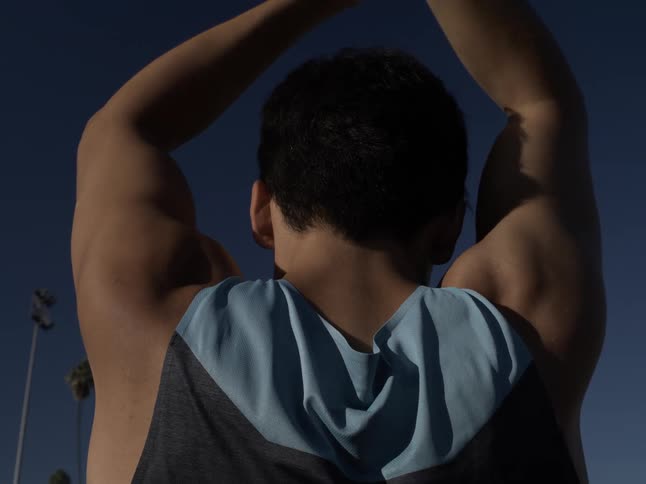 A man is stretching outside