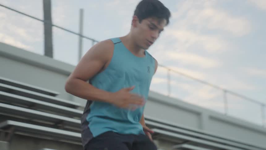 A runner warming up by racing down stairs