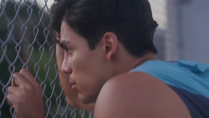 A man taking deep breaths while exercising