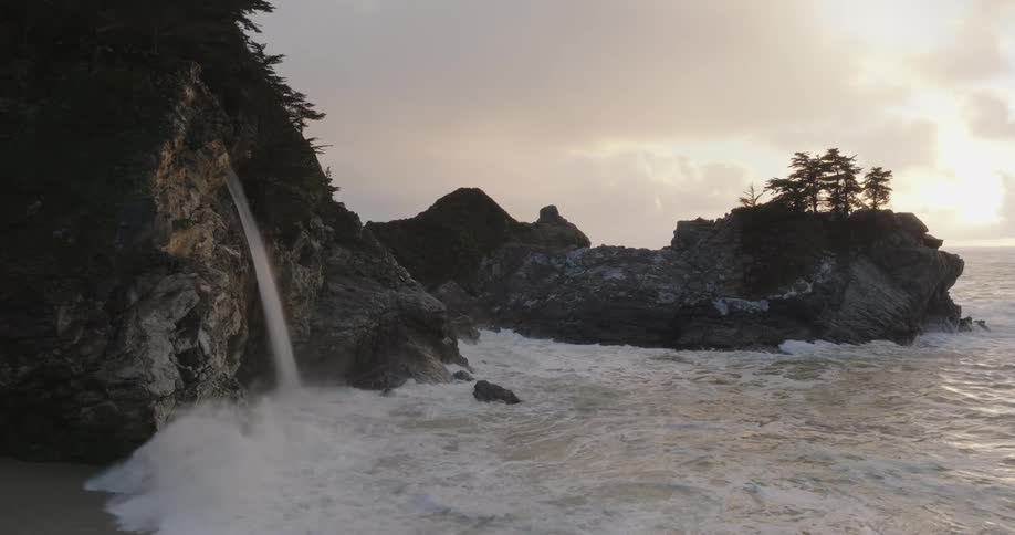 Sea landscape on the coast with a waterfall