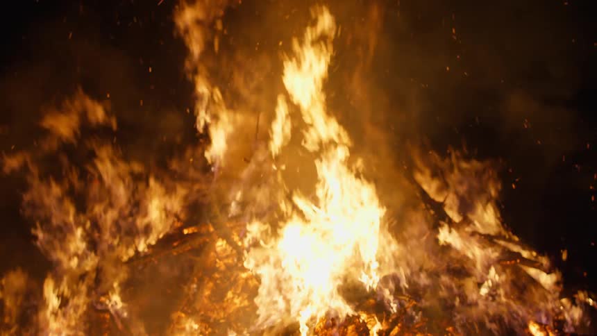 Fire burning wood at night