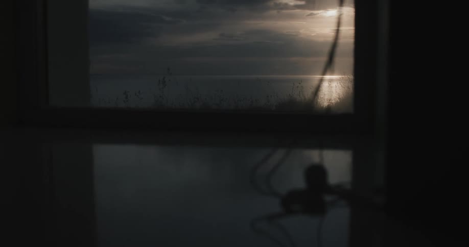 View from the window with a sea landscape on a morning with solar reflection