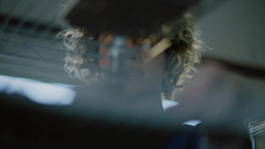 Closeup of a womans face holding trays
