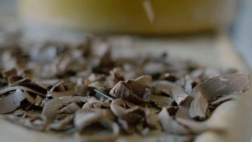 Shavings drop onto a table