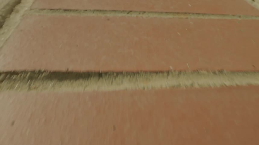 Brick is laid by the sidewalk