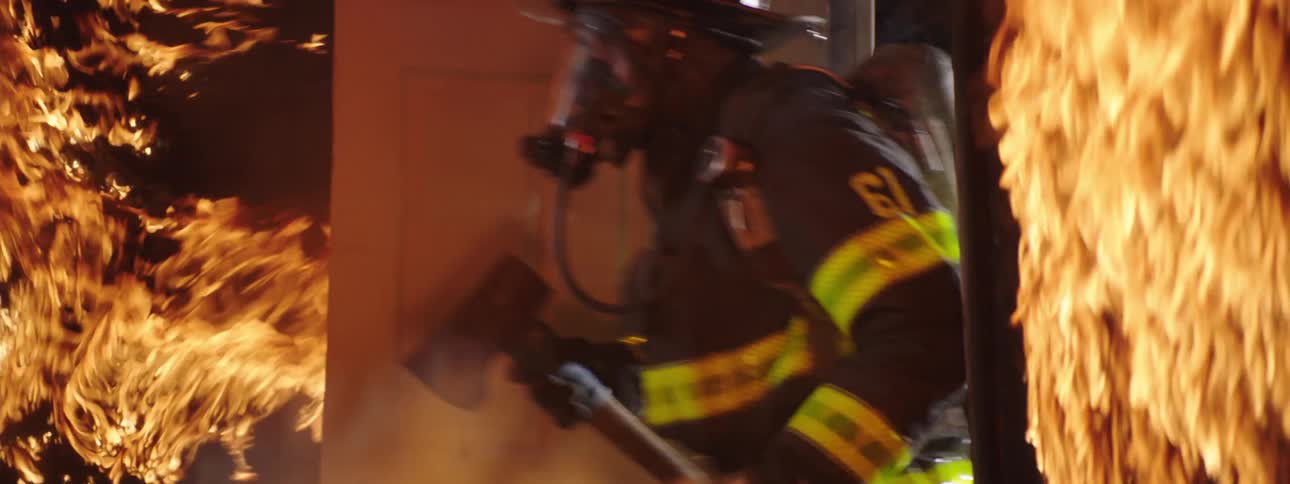 Firefighters invade a burning house during a fire