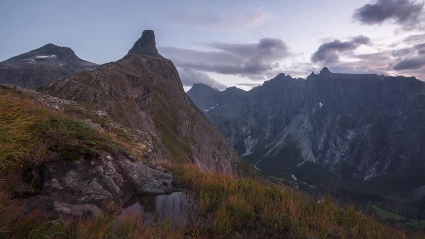 A rugged mountain landscape under a cloudy sky
