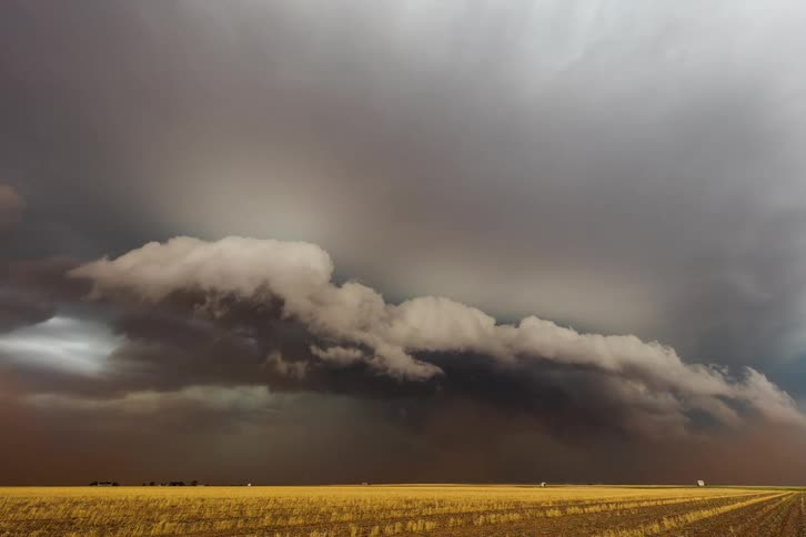 A dust storm is forming on the landscape