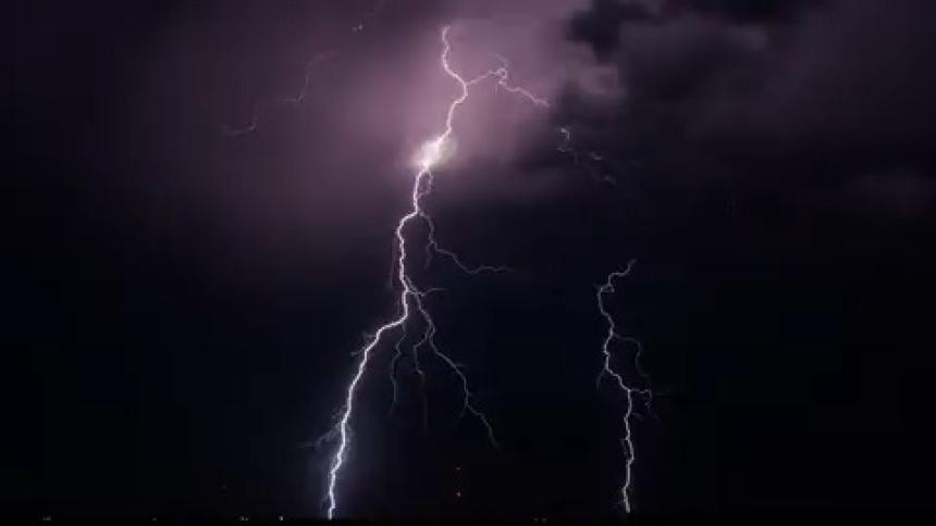 Lightning flashes all over the sky
