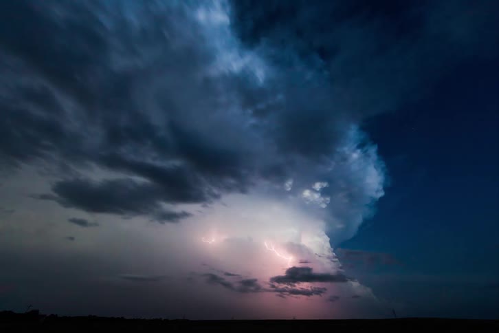 Time lapse of lighting bolts flashing in a storm cloud