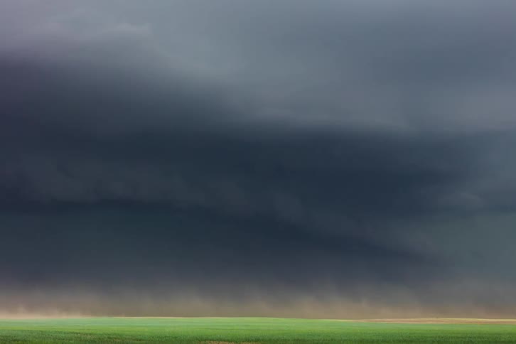 Time lapse of wind blowing under storm clouds in the plains