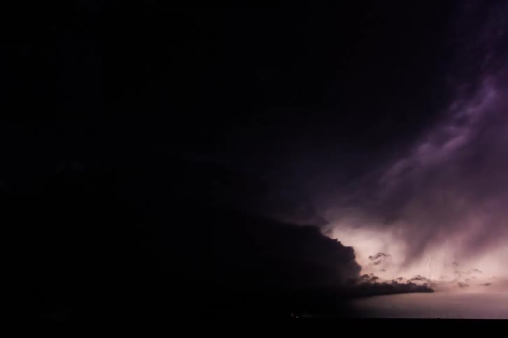 A monster blue supercell flashes at night