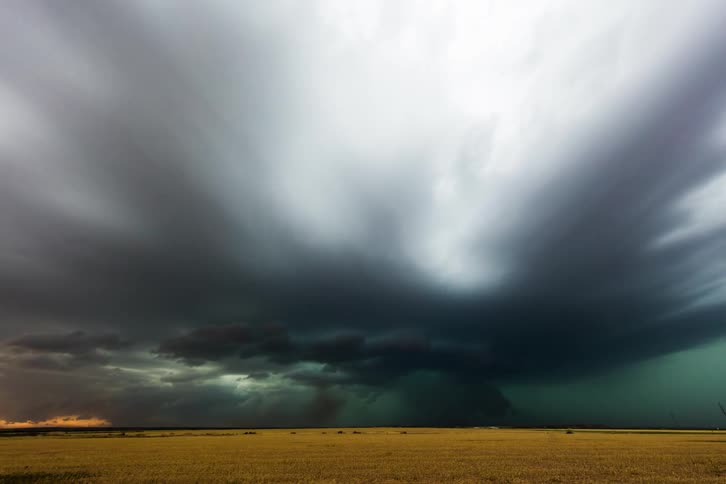 Dark storm clouds formations move through the sky over the plains
