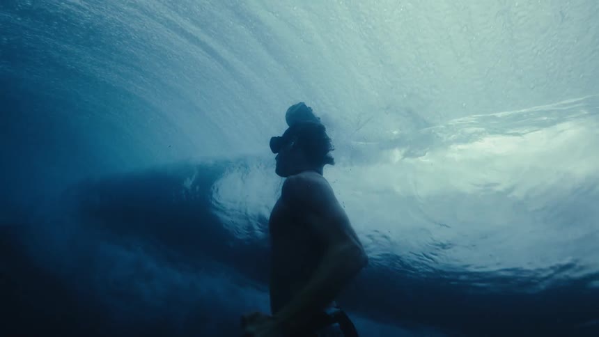 A man filming the sea underwater
