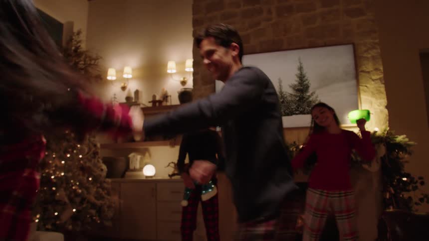 A family dance at home during Christmas