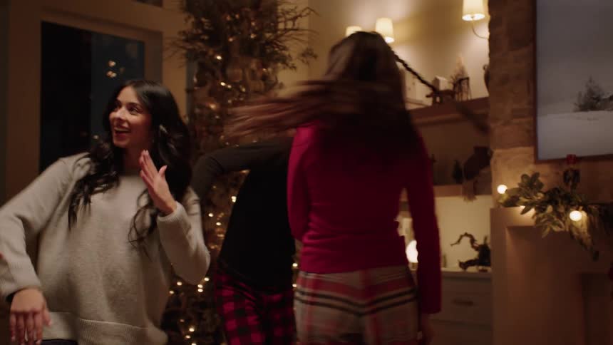 A family dancing together at christmas